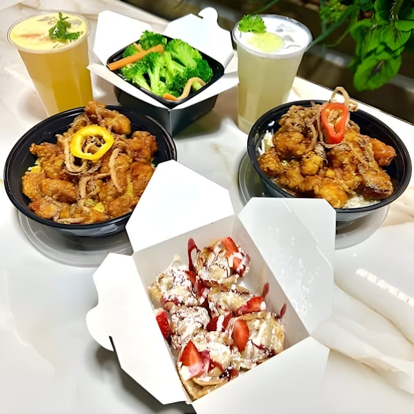 Two Bobby Wong's chicken bowls, a side of broccoli, two drinks, and strawberry dessert in takeout containers.